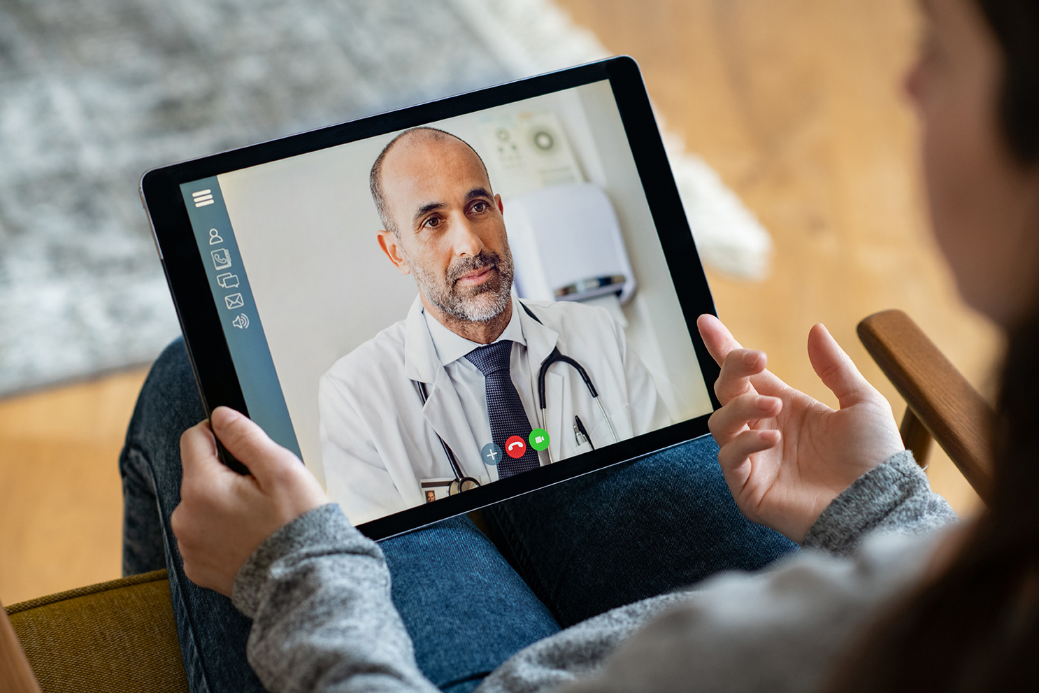 doctor on tablet screen doing telemedicine visit